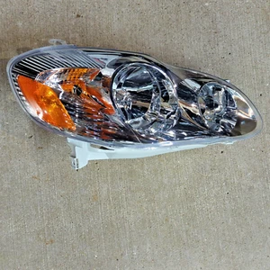 81110-02200 for 2003-2004 Toyota Corolla RH Passenger Side Headlamp Gray Housing - Picture 1 of 12