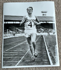 Photo of Derek Ibbotson Great Britian Athlete  winning a 1950's race