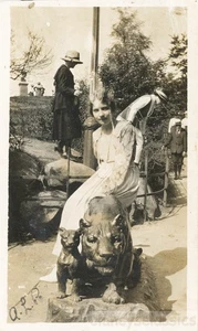 1918 Woman Sits on Leopard Cat Statue in the Park - Picture 1 of 1