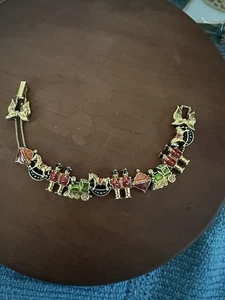 VINTAGE WEIHNACHTEN NUSSKNACKER SCHAUKELPFERD ZUG ARMBAND goldfarben - Bild 1 von 3