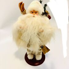 VTG TJ Collection Santa Claus Biege With Skis On Mahogany Colored Stand 1997 