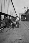 Roadworkers resurface southbound lane bridge wooden blocks Brookly Old Photo