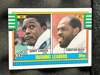 1990 Topps #28 BARRY SANDERS Lions CHISTIAN OKOYE Chiefs Rushing Leaders HOFers - Image 1 of 2