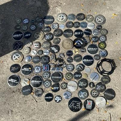 Wholesale Lot Of 100 Aftermarket Custom Rim Wheel Center Hub Caps Emblems Logos - Image 1 of 4