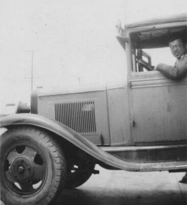 1930s Man Driving Car Closeup Side View Steering Wheel Smile - Picture 1 of 3