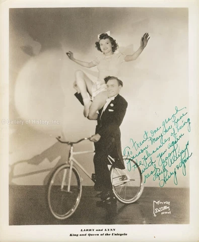 LARRY AND LYNN, KING AND QUEEN OF THE UNICYCLE - INSCRIBED PHOTOGRAPH SIGNED Cover