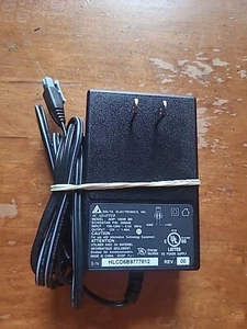 Delta Electronics AC Adapter ADP-18DW BB - Input 100-120V~0.5A 60Hz - Output 12V - Picture 1 of 1