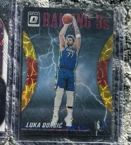 Luka Doncic 2023-24 Panini Donruss Optic /99 Raining 3s Red Gold International - Bild 1 von 2