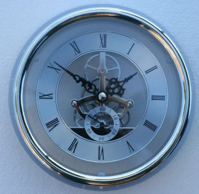 Skeleton Clock 149mm diameter quartz insertion, silver finish with flange fit  - Image 1 of 3