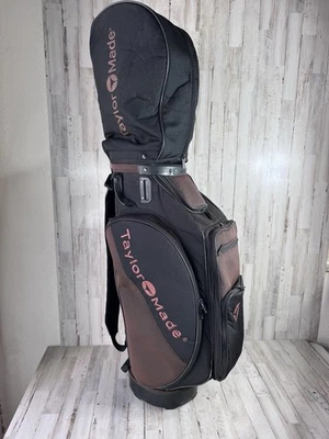 Сумка для гольфкара TaylorMade коричневая черная с несколькими карманами мягкий ремень с дождевиком - Изображение 1 из 4
