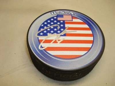 Disco de hockey autografiado por el equipo firmado por Cam Fowler de EE. UU. 1B Foto 1 de 2