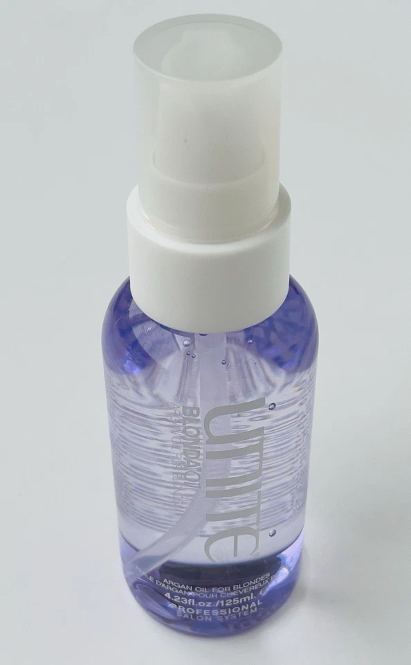 Aceite de argán transparente UNITE BLONDA para rubias 4,23 oz Foto 1 de 3