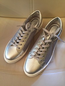 silver athletic shoes