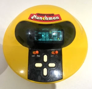 TESTED WORKS VINTG 1982 GRANDSTAND MUNCHMAN ELECTRONIC HANDHELD ARCADE GAME BA92 - Picture 1 of 9