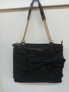 Black Fabric Kate Spade Purse With Gold Tone Chain Strap and Large Bow on Front