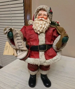 Figura de Papá Noel Kurt Adler Fabriche con lista traviesa y bonita y bolsa de juguetes - Imagen 1 de 9