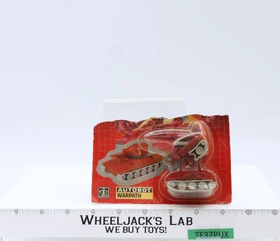 Figura de acción de colección Hasbro Warpath G1 Transformers 1985 NUEVA MOSC Foto 1 de 4