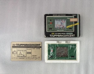 Reloj Bandai Game Tsuppari Concierto LCD Portátil De Colección Japón Nuevo Sin Usar - Imagen 1 de 2