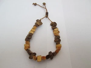 CORD BRACELET WITH BROWN AND BEIGE COLOURED POLISHED BEADS. - Picture 1 of 3