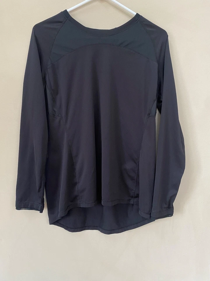 Feminino C9 Champion Med. Camisa atlética manga longa preta reflexiva furos para polegar - Imagem 1 de 4