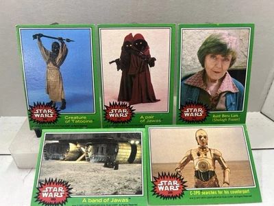 1977 Topps Star Wars Lote de 5 Tarjetas Frontera Verde Jawas Tusken Raider C-3PO Foto 1 de 4