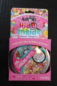 Masilla Crazy Aaron's Hide Inside Dulce Sorpresa Masilla Transparente con Piezas 3.2 OZ. - Imagen 1 de 2
