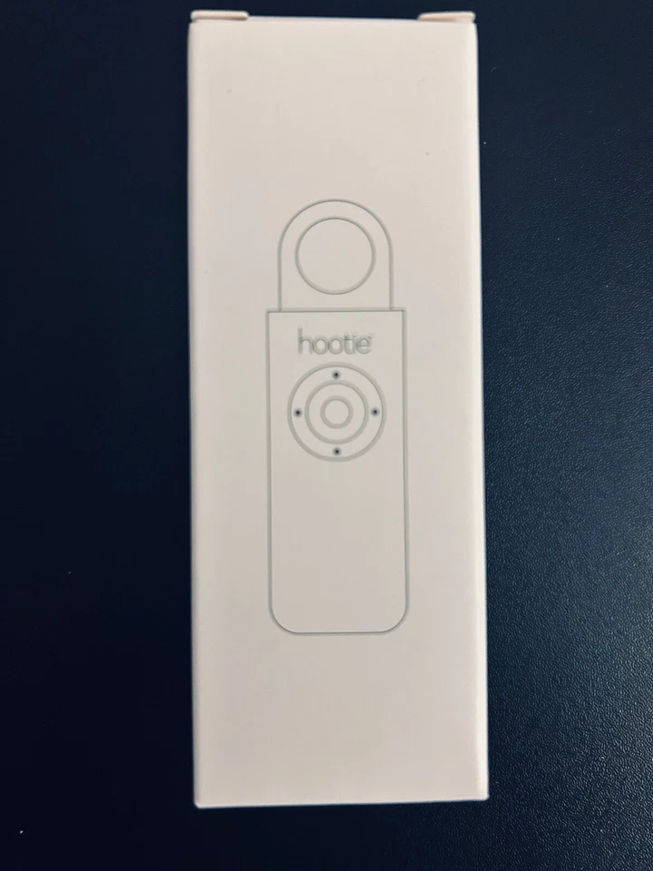 hootie alarme porte clef état neuf blanc  - Photo 1/1