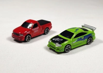  JADA Micro Fast & Furious F-150 SVT Red Pickup And Green Mistubishi Eclipse  - Image 1 of 4