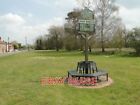 PHOTO  WEST RUDHAM VILLAGE SIGN THE SIGN IS HEADED BY A HORSESHOE AND EARS OF WH