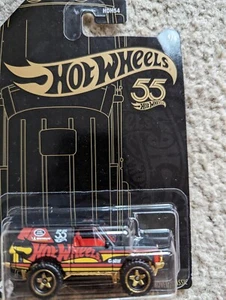 Hot Wheels Range Rover Classic 55th Anniversary schwarz und gelb LKW - Bild 1 von 3