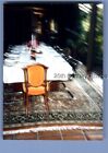 FOUND COLOR PHOTO K+9602 BLURRED VIEW OF SET TABLE AND CHAIRS