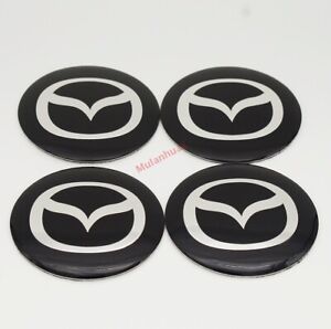4x 65 mm insignia de centro de Pegatinas de Rueda Mazda se ajusta Centro HUB Tapa De Moldura De Aleación B
