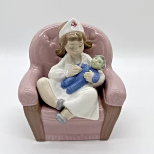 NAO By Lladro “Girl Playing Nurse” #1055 Porcelain Figurine - Picture 1 of 7