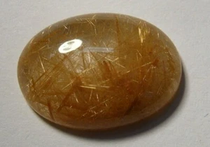 Rutilquarz Cabochon, 18 x 13 mm oval, mit dichten goldfarbenen Nadeln - Bild 1 von 1