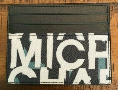 NUEVO CON ETIQUETAS Michael Kors Cooper Estuche/Cartera Alta de Cuero Almirante Blanca Como Nueva Multi  Foto 1 de 4