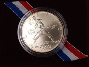 1992 Olympic Commem UNC Silver $1 Coin in Original Government Packaging - Picture 1 of 4