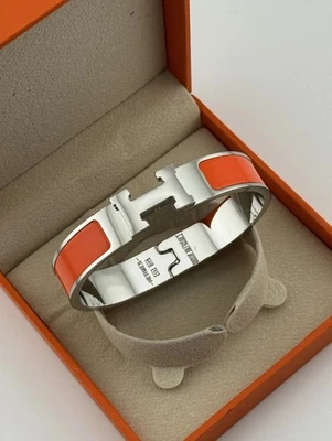 Brazalete Brazalete Hermes Unisex Naranja Ovalado Esmalte a Presión Tono Plateado  Foto 1 de 4