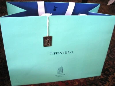 TIFFANY & CO - LANDMARK STORE SILVER-TONE CHARM and PAPER SHOPPING / GIFT BAG - Image 1 of 4