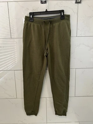 Pantalones de chándal cónicos ajustados impermeables vintage para hombre M verde oliva salón Foto 1 de 3