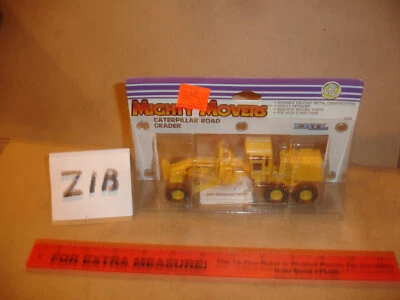 1/64 Mighty Movers Caterpillar Road Grader - in original package - Image 1 of 2