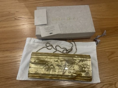 Bolso clutch Jimmy Choo de acrílico dorado Foto 1 de 4