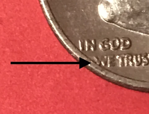 error 1973-D Roosevelt dime off center strike at W in God we trust  Cover