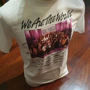 T-shirt USA for Africa New Never Worn Live Aid, We Are the World, Hanes rare - Foto 1 di 9
