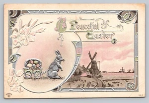 AK Kaninchen mit Wagen voller Ostereier Fantasie Friedliches Ostern EMB unbenutzt - Bild 1 von 3