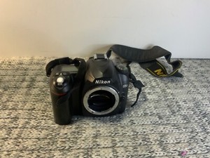 Nikon D50 black digital camera body and Battery only /Works