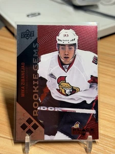 Gemas de novato MIKA ZIBANEJAD 2011-12 cubierta superior rubí cuádruple/100 radiocontrol - Imagen 1 de 2