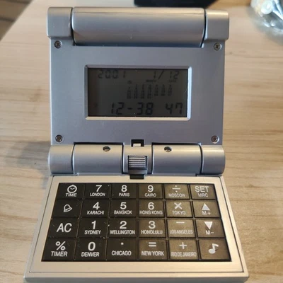 Collapsible Travel Alarm clock, calculator, world time, calendar, 3.5” Folded - Image 1 of 4