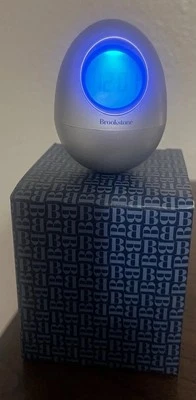Brookstone “Bob” Silver Oval Egg Wobble Clock 5-in-1 Alarm Date Timer Temp Time  - Image 1 of 4