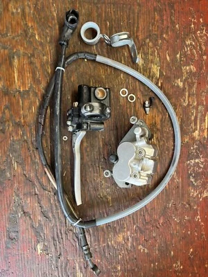 Pinza de freno delantera Kawasaki KLX250SF 2009-2010, cilindro maestro y manguera Foto 1 de 4