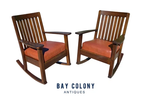 PAIR OF ANTIQUE ARTS & CRAFTS TIGER OAK ROCKING CHAIRS WITH ORANGE LEATHER SEATS Cover